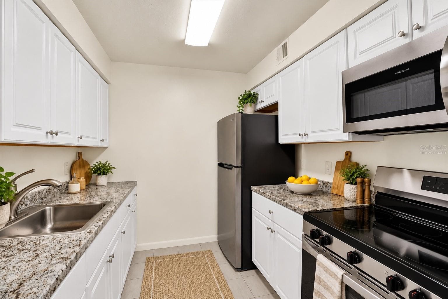 Kitchen virtually staged - 9130 TUDOR DR #M105, TAMPA