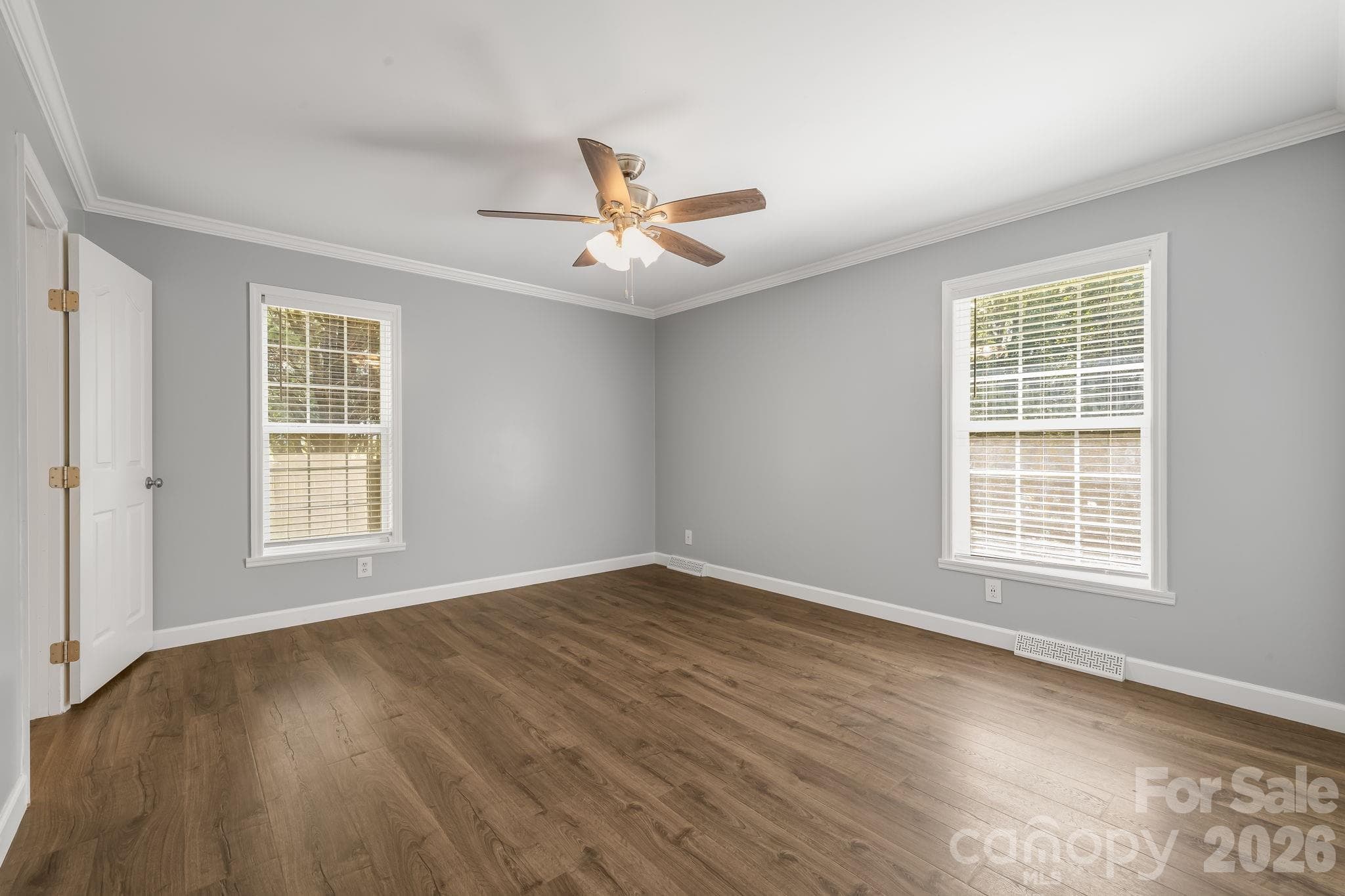 Unwind in your spacious primary bedroom. - 710 Stoney Mountain Road, Hendersonville