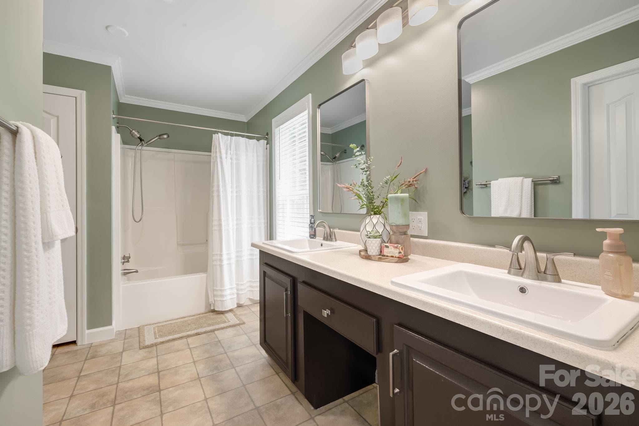 Ease into your morning with room to get ready at the double vanity. - 710 Stoney Mountain Road, Hendersonville