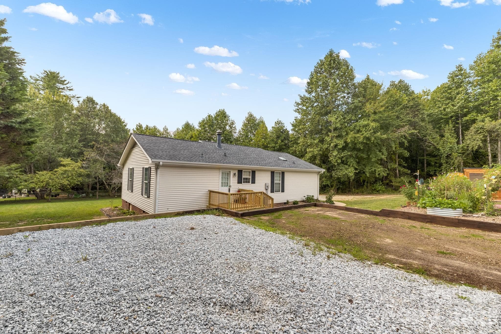 Picture a patio for outdoor dinners, a play area, or your own creative use for this flexible backyard space. - 710 Stoney Mountain Road, Hendersonville