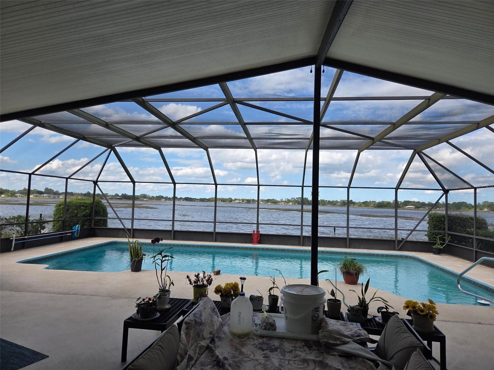 Pool view overlooking Lake Theresa - 2526 RUSK CT, DELTONA