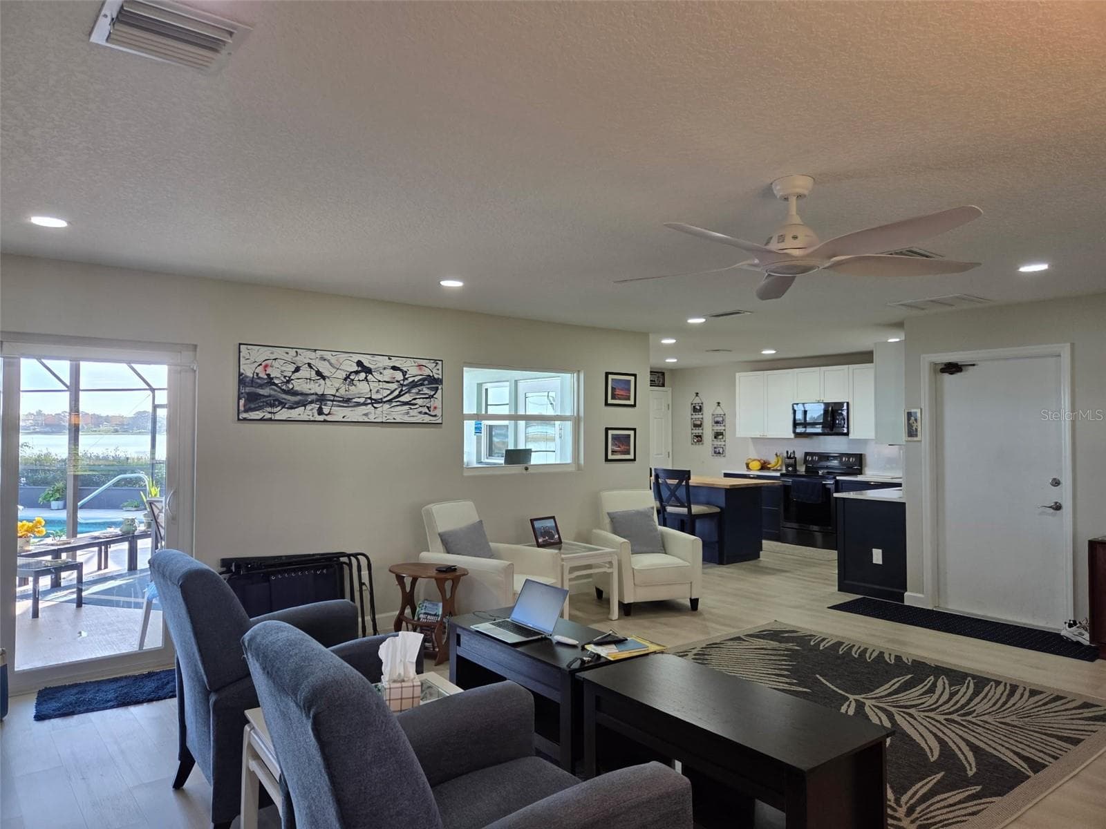 View of the kitchen from the great room - 2526 RUSK CT, DELTONA