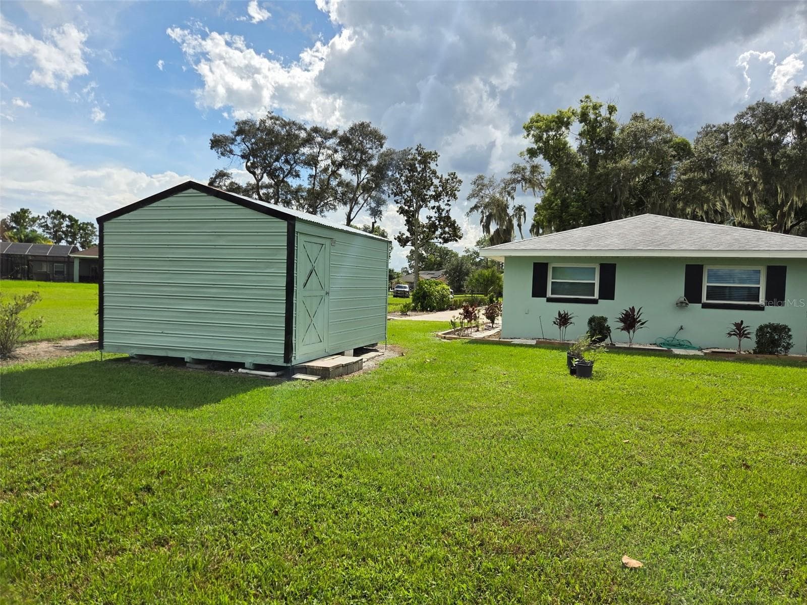 Rear view of the property - 2526 RUSK CT, DELTONA