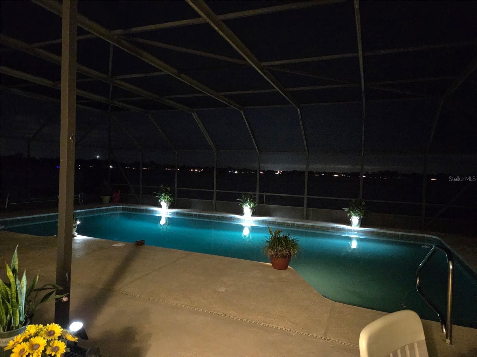 Pool view after dark - 2526 RUSK CT, DELTONA