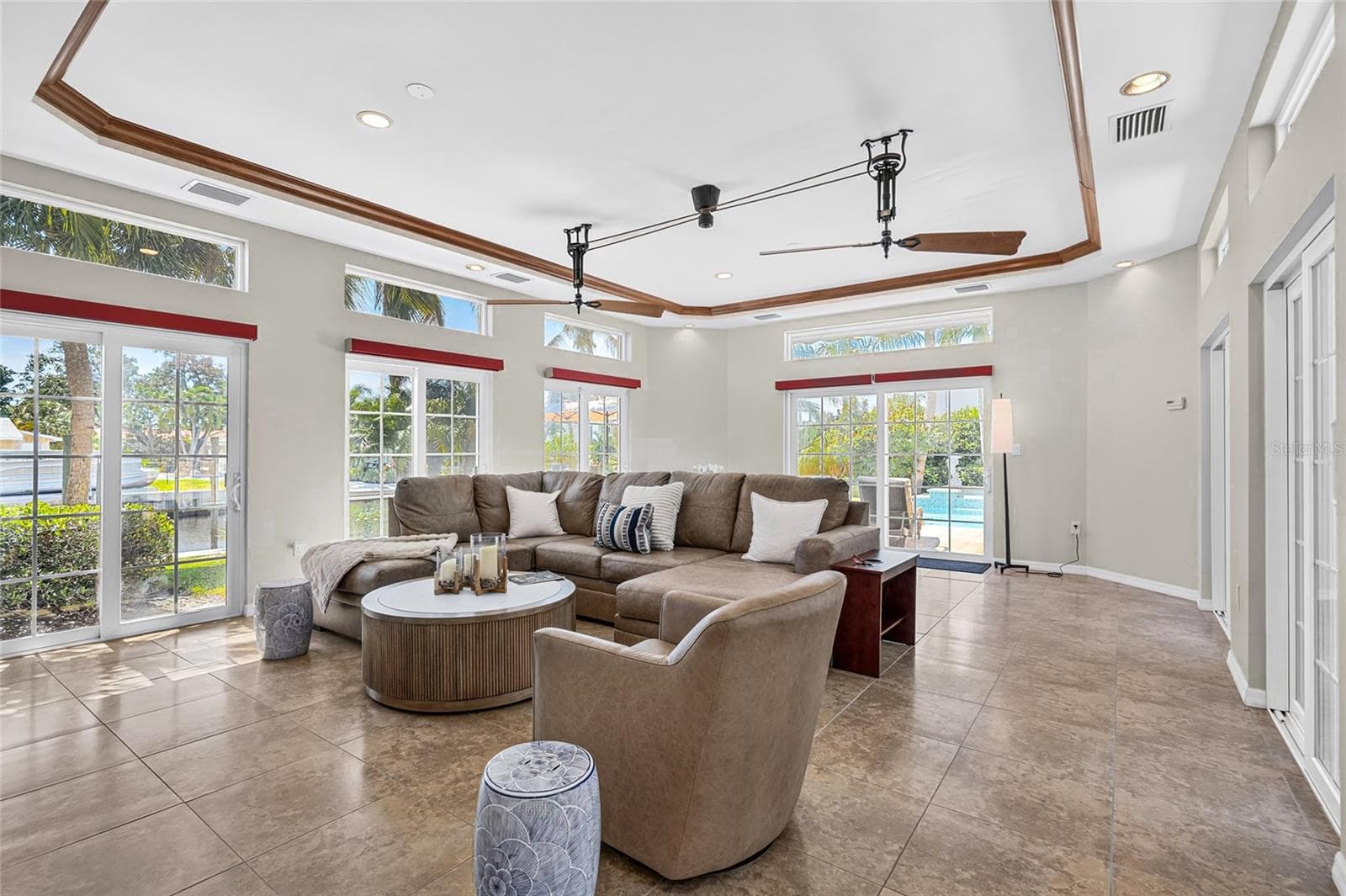 Spacious flex room features tall ceilings, abundant natural light and easy access to the outdoor living areas. - 5376 SHADOW LAWN DR, SARASOTA