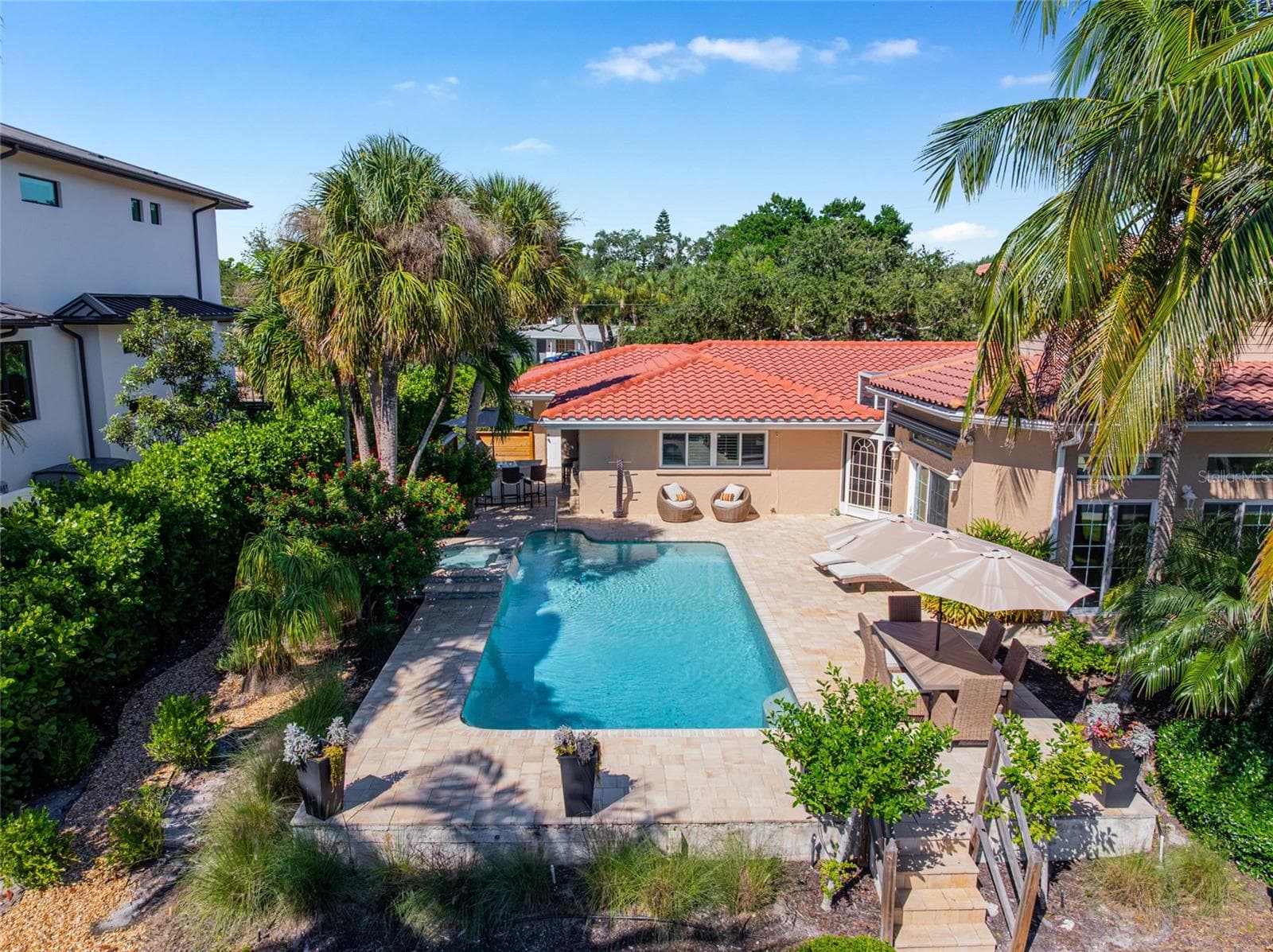 Elevated daytime view captures the pool, patio and generous rear outdoor spaces. - 5376 SHADOW LAWN DR, SARASOTA
