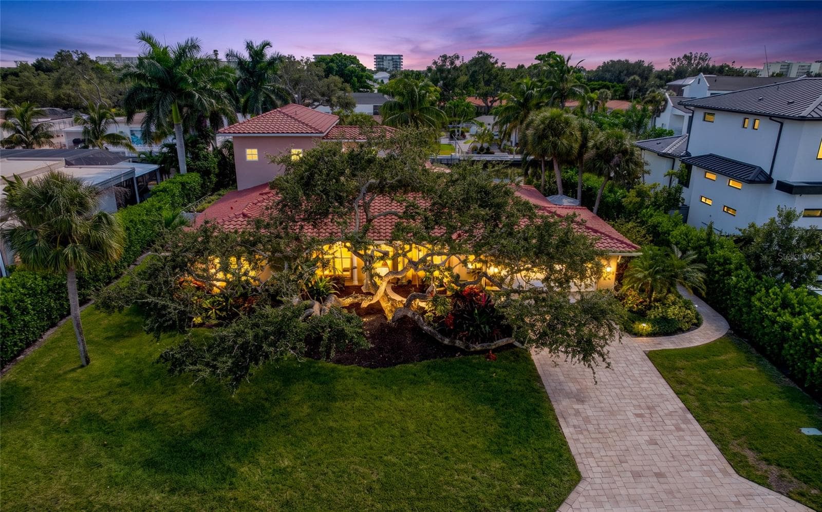 Front Aerial Twilight, providing a broader perspective of the property and its Siesta Key setting. - 5376 SHADOW LAWN DR, SARASOTA