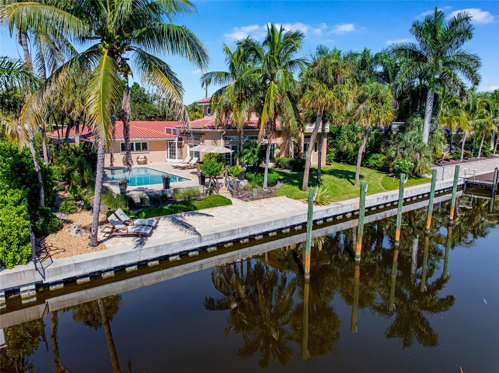 Canal Frontage Aerial, providing a broader perspective of the property and its Siesta Key setting. - 5376 SHADOW LAWN DR, SARASOTA