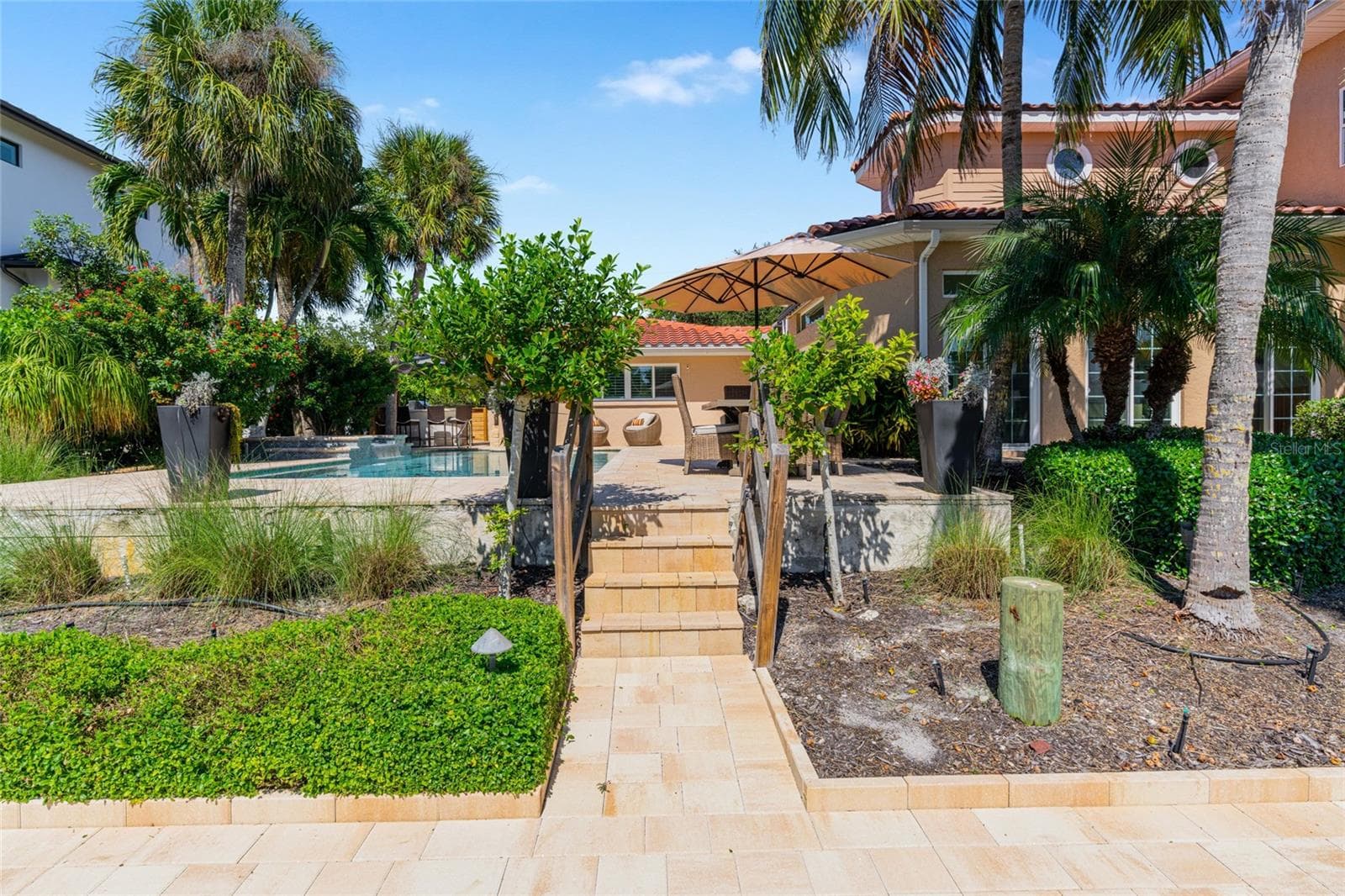 Paver Path To Waterfront, highlighting the connection to the water and Siesta Key lifestyle. - 5376 SHADOW LAWN DR, SARASOTA