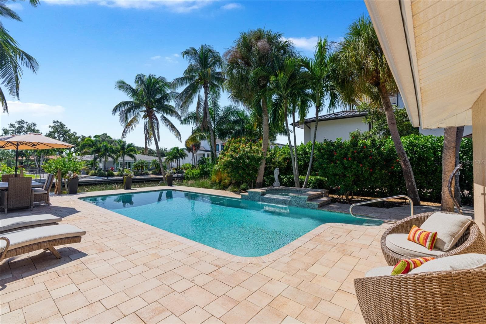 Pool Patio Daytime, creating an inviting setting for relaxing and entertaining. - 5376 SHADOW LAWN DR, SARASOTA