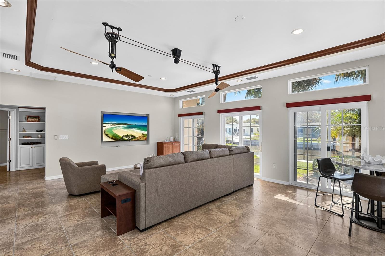 Wide view of the approximately 424 square foot flex room, preserved after the adjoining fifth bedroom was created. - 5376 SHADOW LAWN DR, SARASOTA