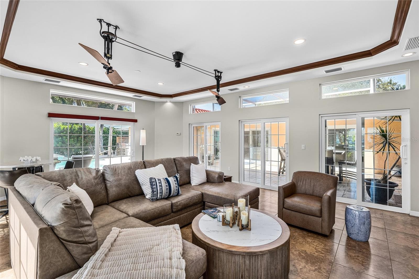 The approximately 424 square foot flex room offers generous space for media, games, fitness, lounging or other flexible uses. - 5376 SHADOW LAWN DR, SARASOTA