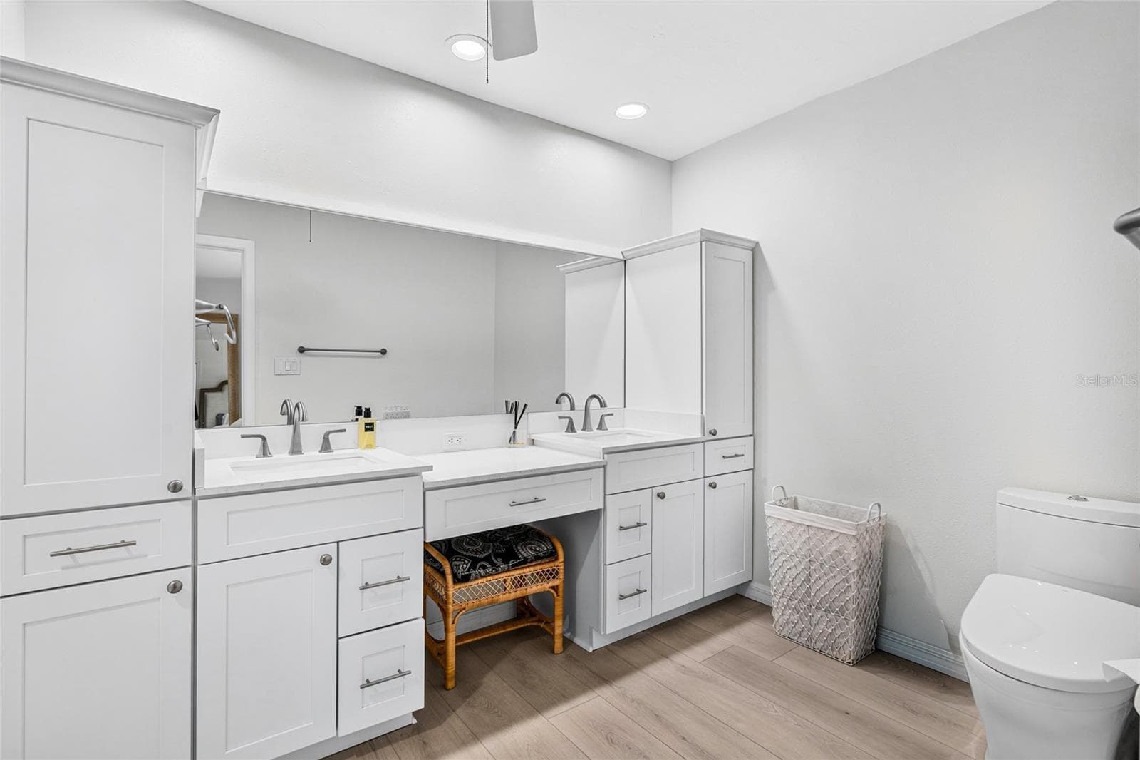 The first floor primary bath was beautifully renovated in 2026 with a dual vanity and upscale finishes. - 5376 SHADOW LAWN DR, SARASOTA