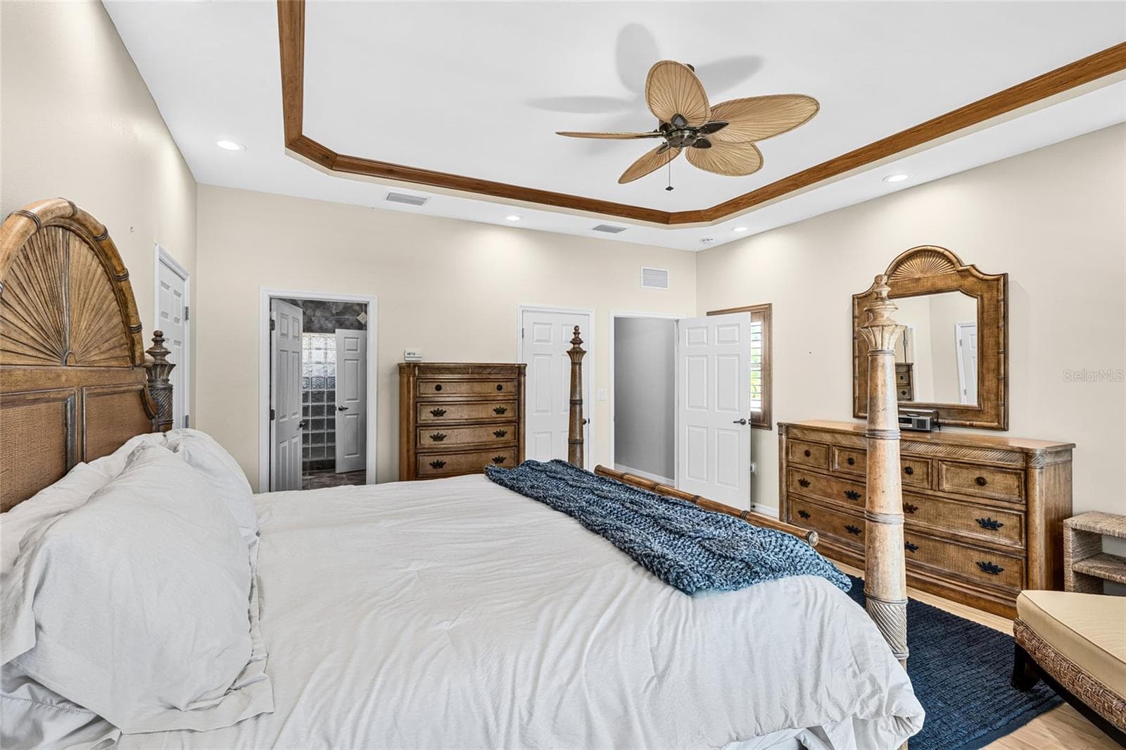 Another view of the second floor primary retreat highlights its spacious layout and peaceful private setting. - 5376 SHADOW LAWN DR, SARASOTA