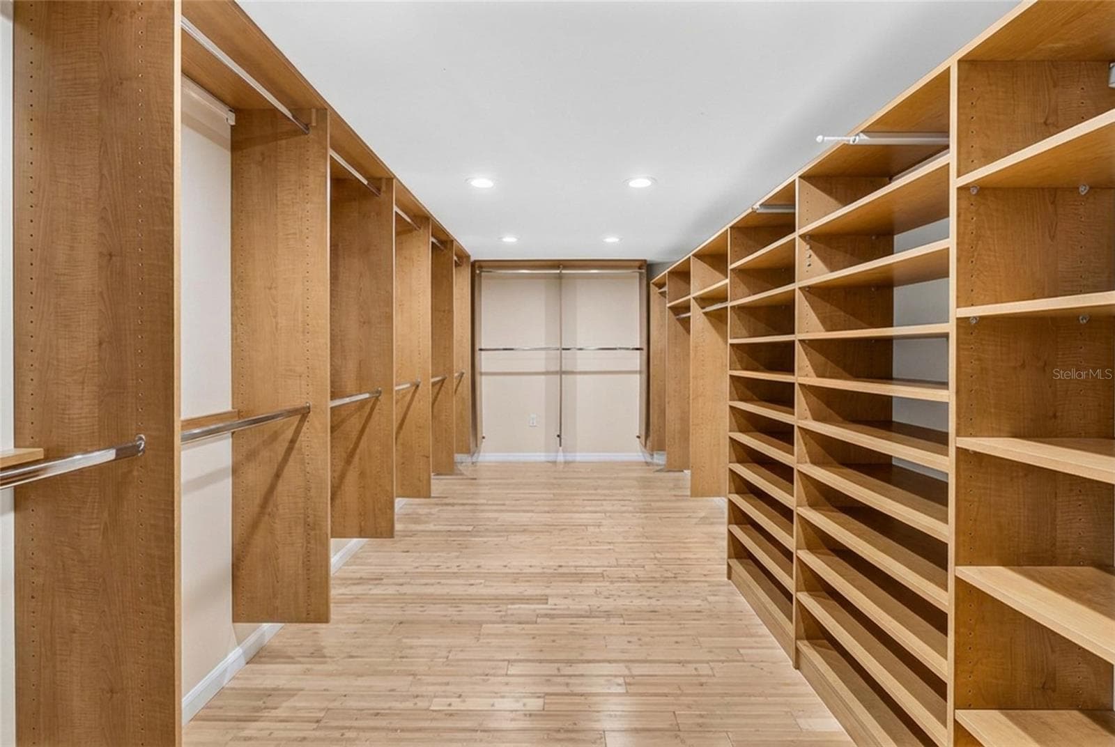One of two walk in closets in the second floor primary suite offers exceptional storage space. - 5376 SHADOW LAWN DR, SARASOTA