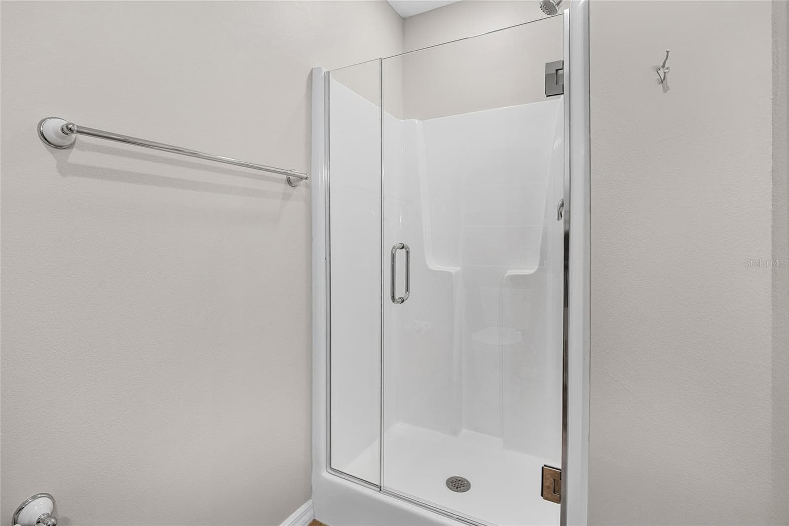 Bathroom 4 Glass Shower, with clean finishes and practical function. - 5376 SHADOW LAWN DR, SARASOTA