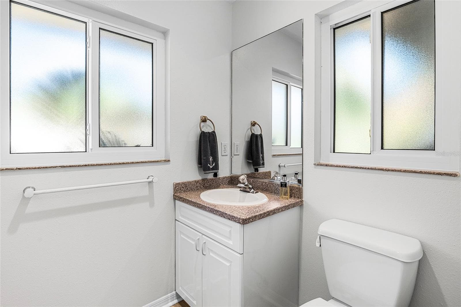 Convenient powder room serves the main living areas. - 5376 SHADOW LAWN DR, SARASOTA