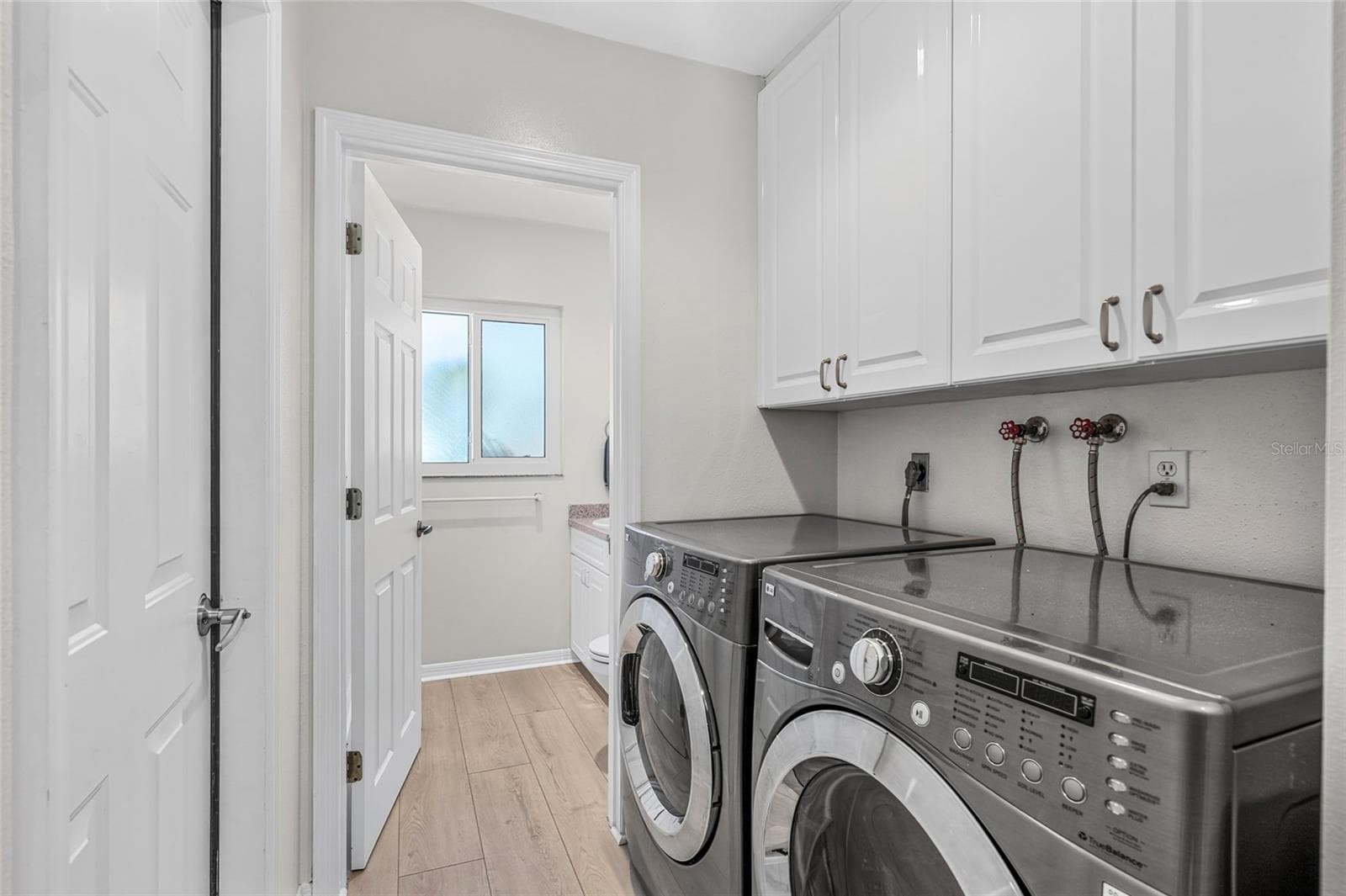 Laundry Room, adding useful function and storage. - 5376 SHADOW LAWN DR, SARASOTA