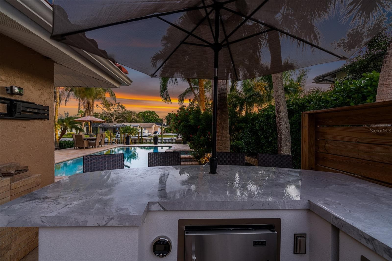 Outdoor Kitchen Twilight, designed for everyday living and easy entertaining. - 5376 SHADOW LAWN DR, SARASOTA