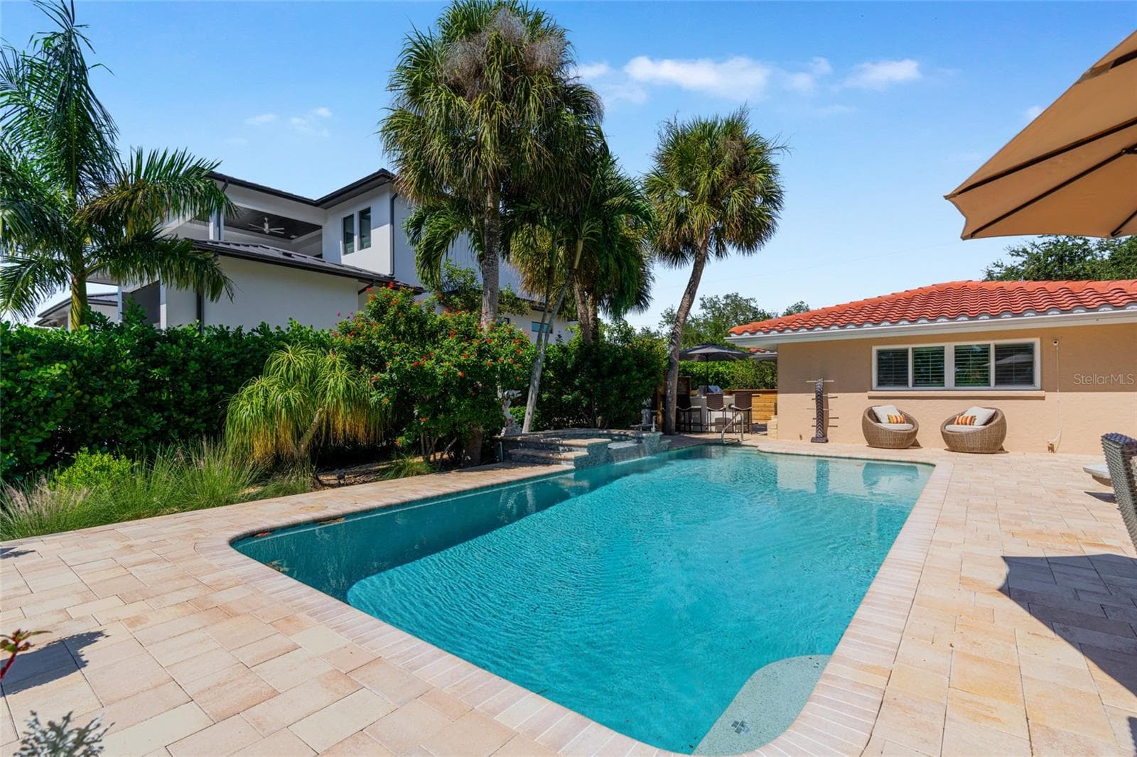 Pool Rear Daytime, creating an inviting setting for relaxing and entertaining. - 5376 SHADOW LAWN DR, SARASOTA