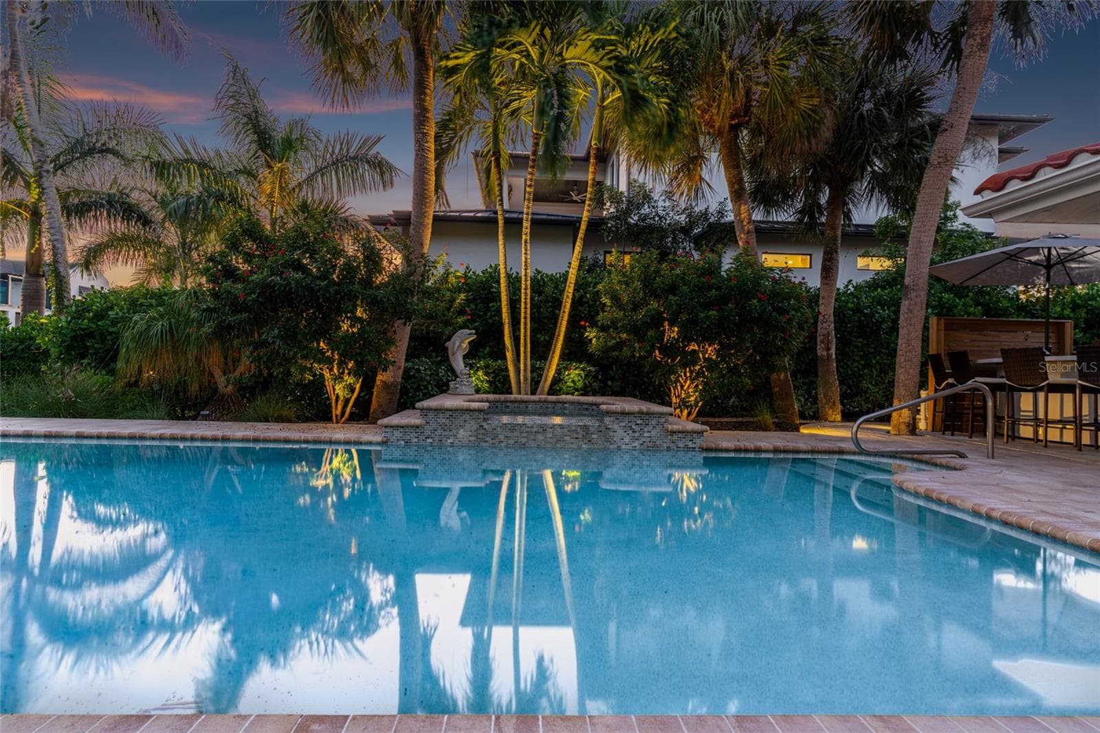 Pool Twilight Reflection, creating an inviting setting for relaxing and entertaining. - 5376 SHADOW LAWN DR, SARASOTA