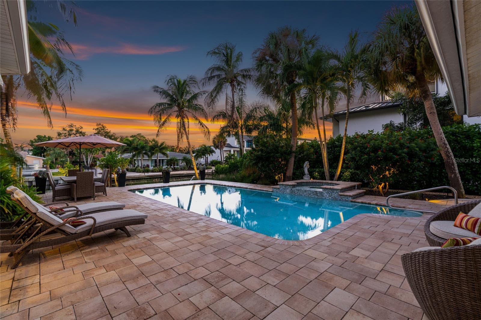 Pool Sunset, creating an inviting setting for relaxing and entertaining. - 5376 SHADOW LAWN DR, SARASOTA