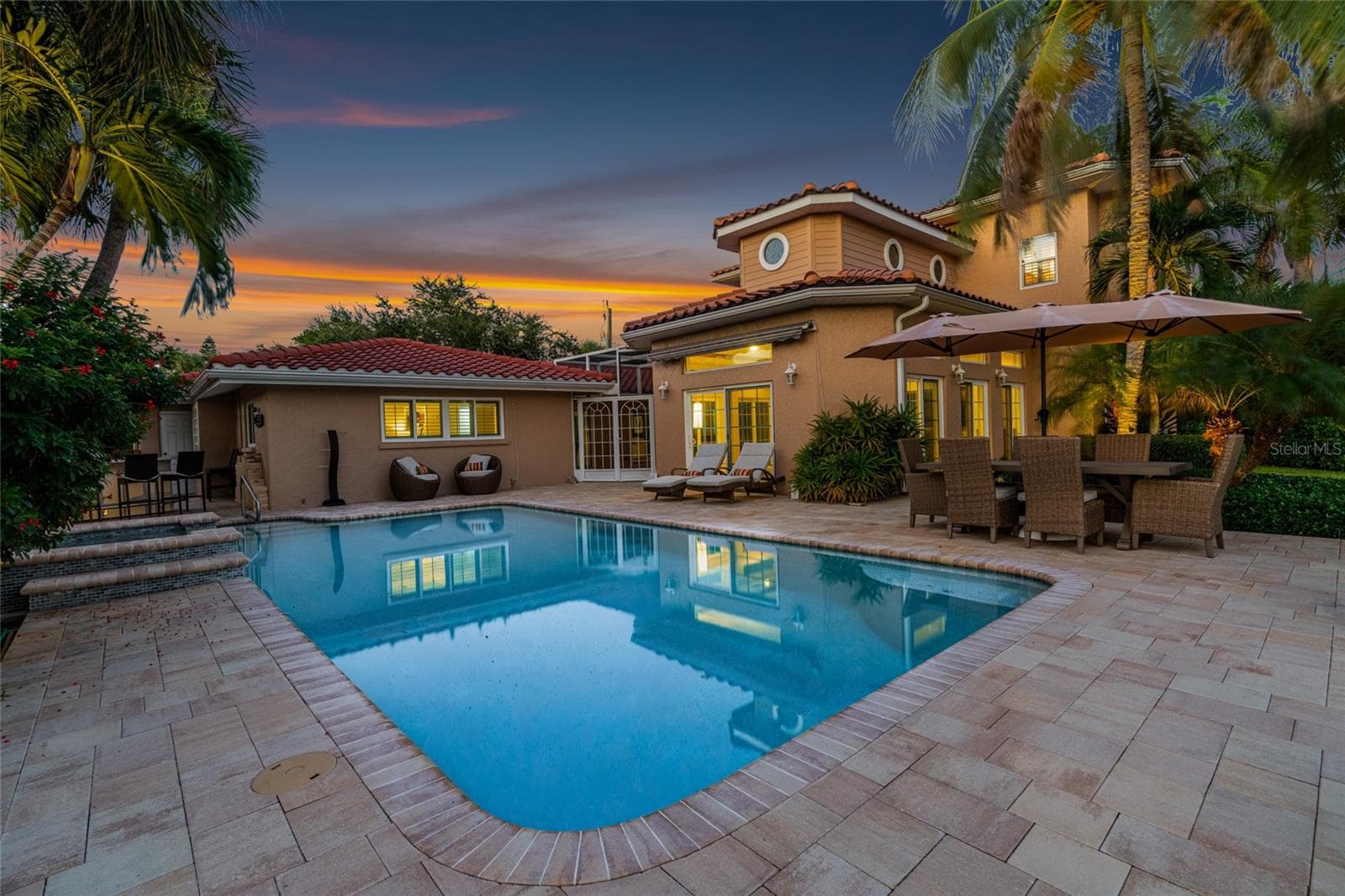 Pool Sunset, creating an inviting setting for relaxing and entertaining. - 5376 SHADOW LAWN DR, SARASOTA