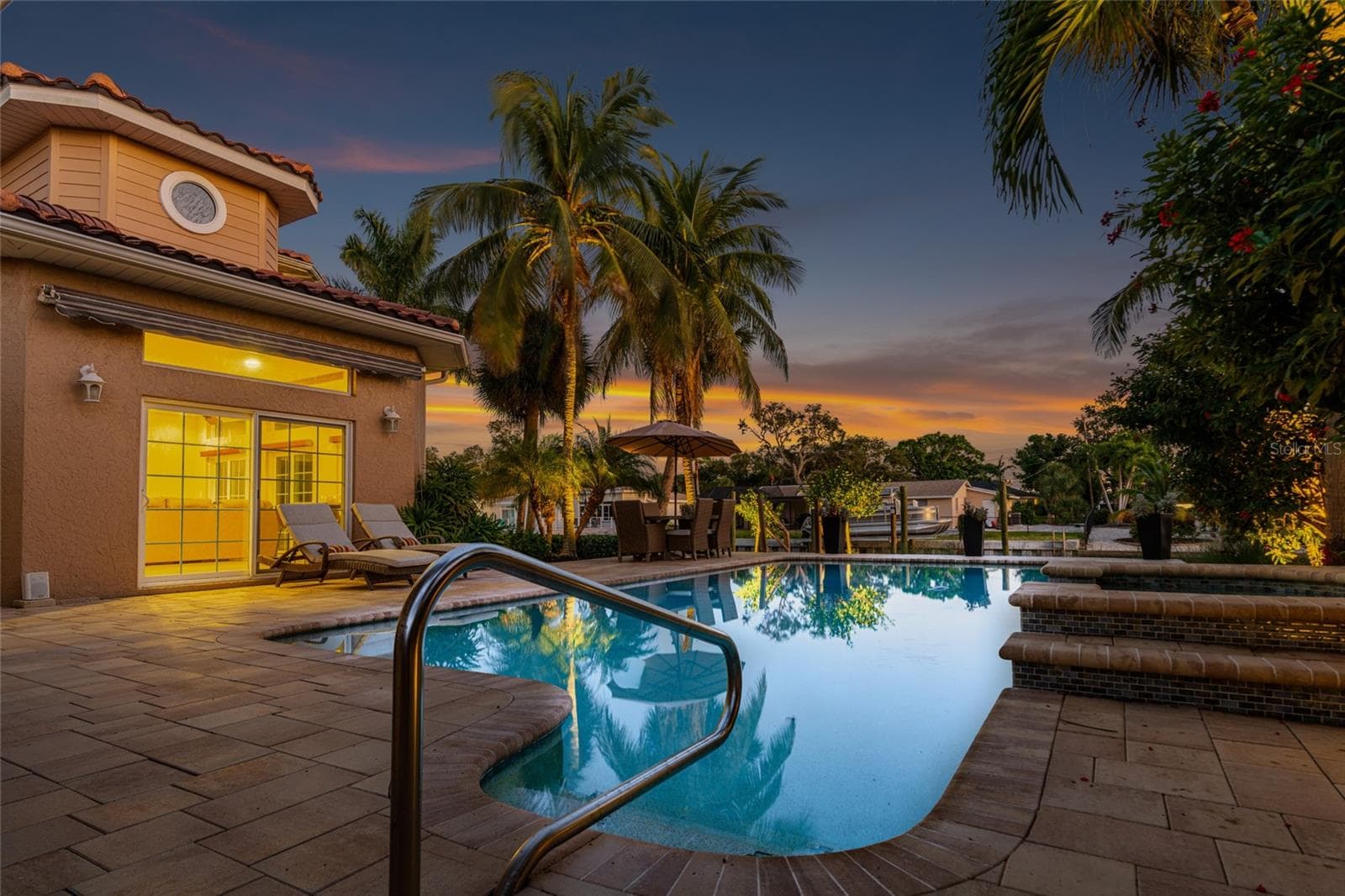 Pool Entry Twilight, creating an inviting setting for relaxing and entertaining. - 5376 SHADOW LAWN DR, SARASOTA