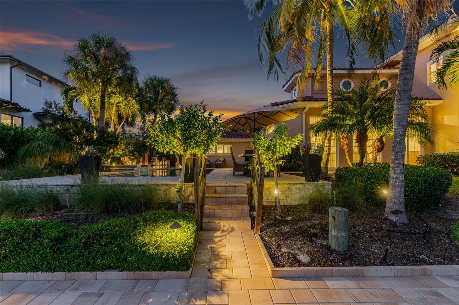 Waterfront Path Night, highlighting the connection to the water and Siesta Key lifestyle. - 5376 SHADOW LAWN DR, SARASOTA