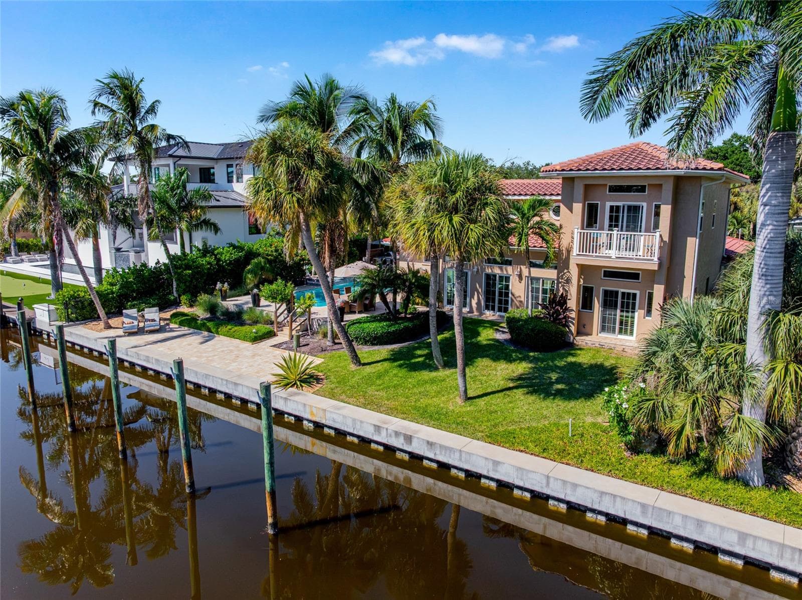 Rear Waterfront Aerial, providing a broader perspective of the property and its Siesta Key setting. - 5376 SHADOW LAWN DR, SARASOTA