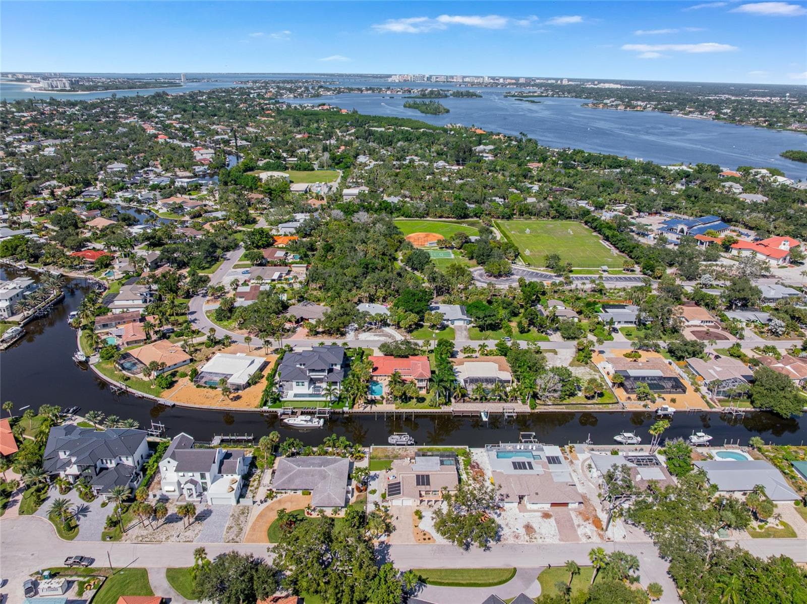 Wide aerial view showing the home’s Siesta Key setting near the Gulf, beach and surrounding waterways - 5376 SHADOW LAWN DR, SARASOTA