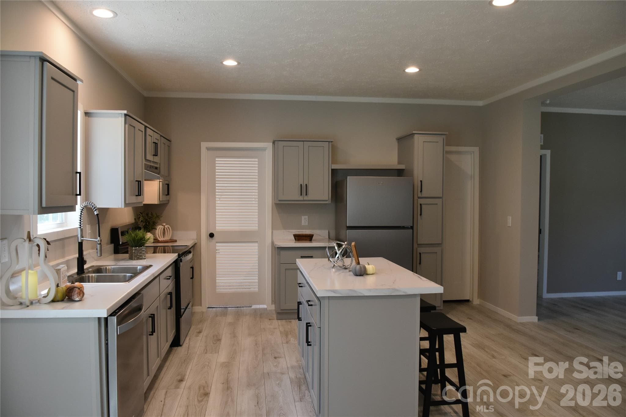 large kitchen island with lots of cabinets for storage - 105 Cottontail Lane, Statesville