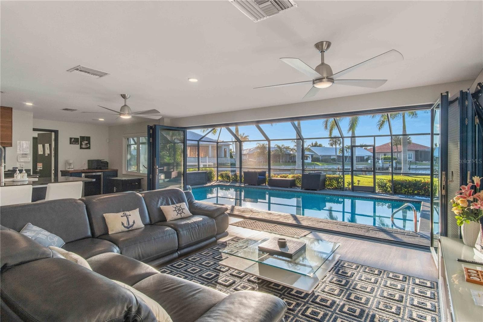 Living room overlooking patio - 131 CASA LN, PUNTA GORDA