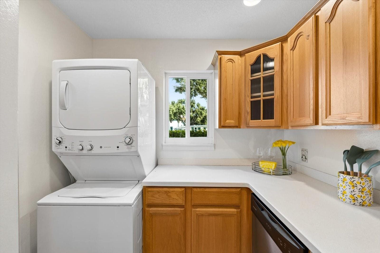 stackable laundry in kitchen - 172 115TH AVE N #172, ST PETERSBURG