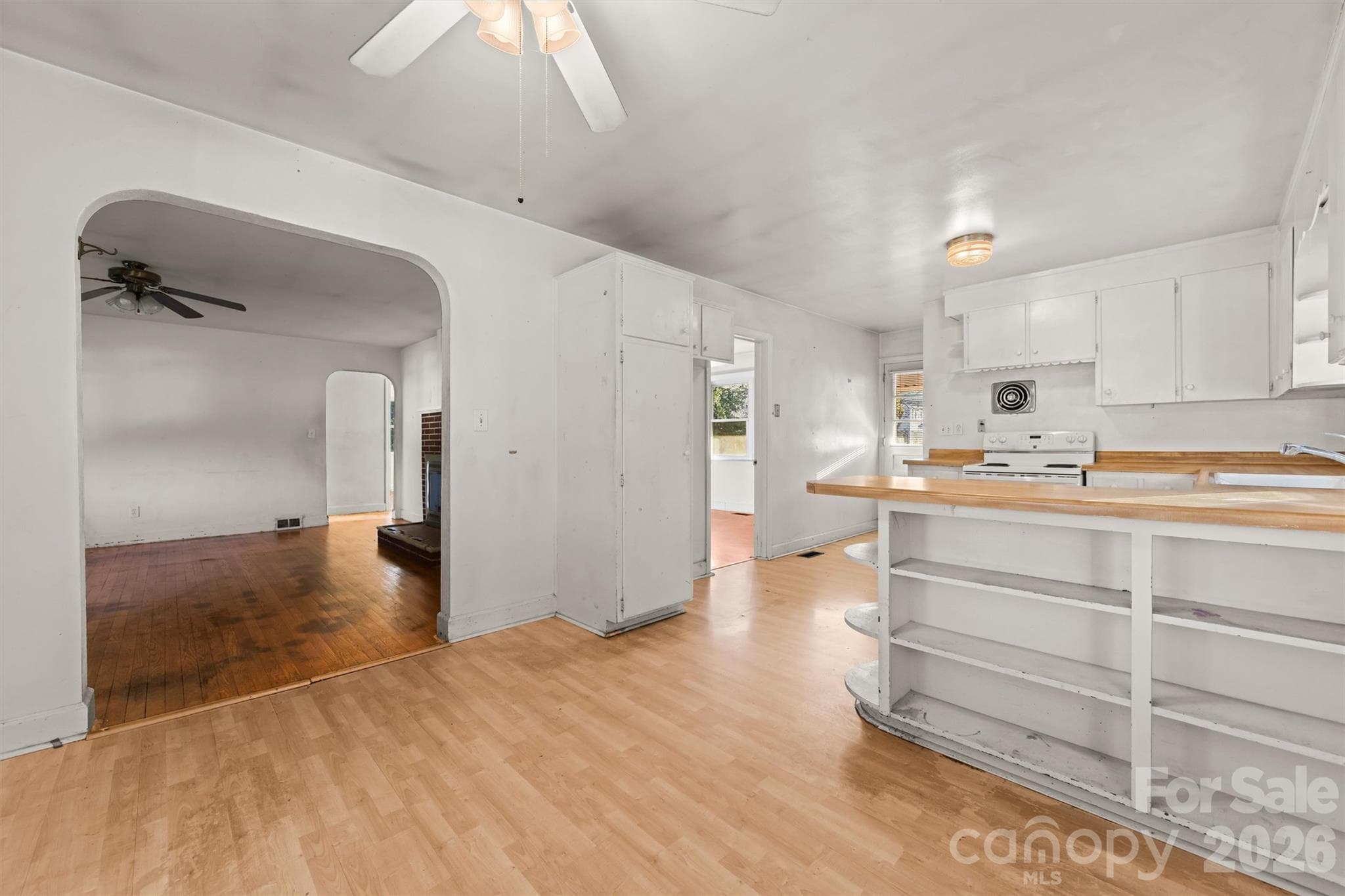 Dining area in Kitchen adjoins the living room through arched doorway - 108 Morgan Street, Canton