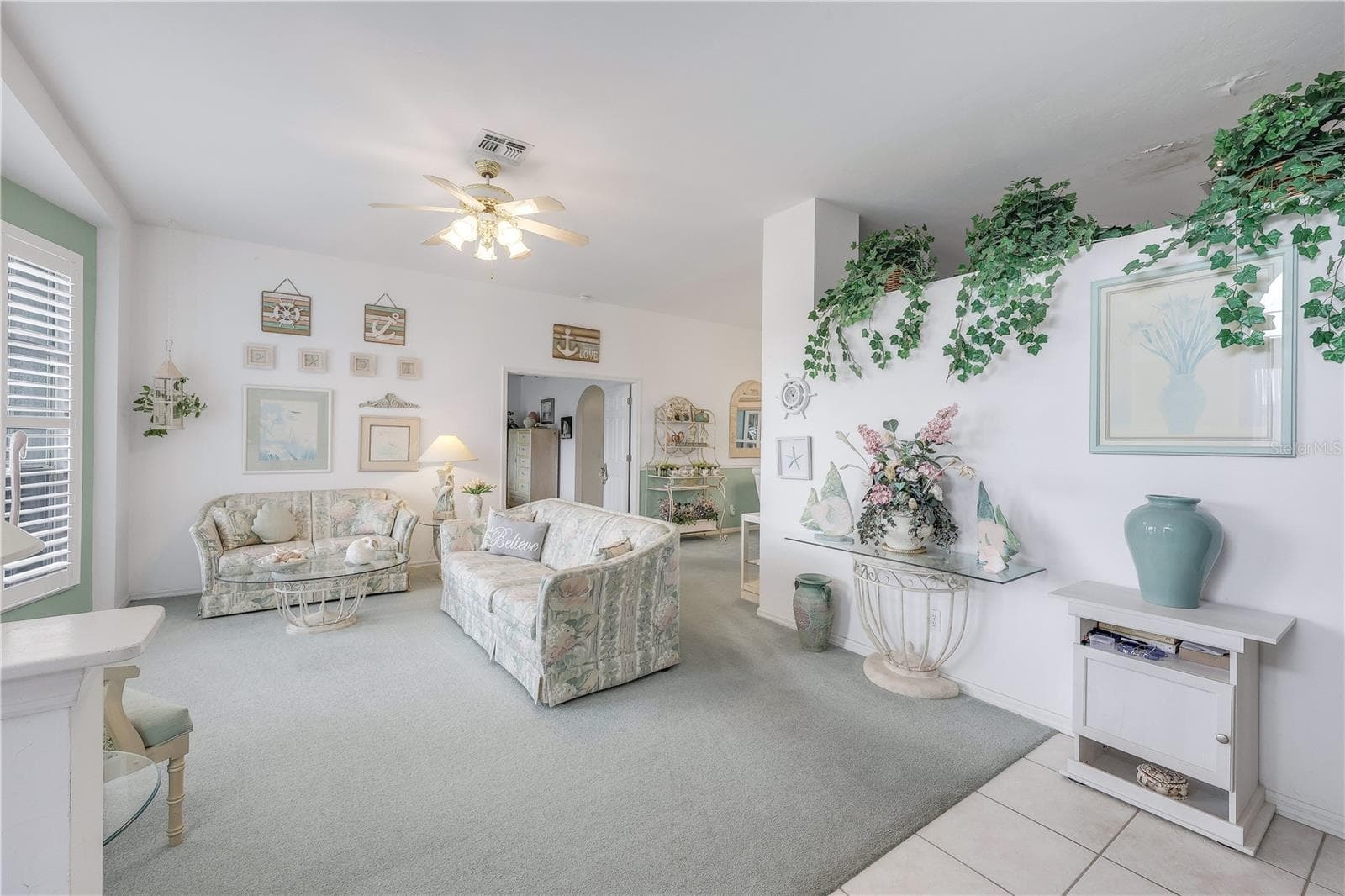 Living room toward primary bedroom and final dining room. - 305 SE 31ST ST, CAPE CORAL