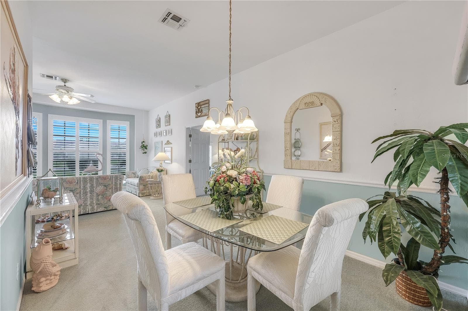 Formal dining room toward living room and primary bedroom. - 305 SE 31ST ST, CAPE CORAL