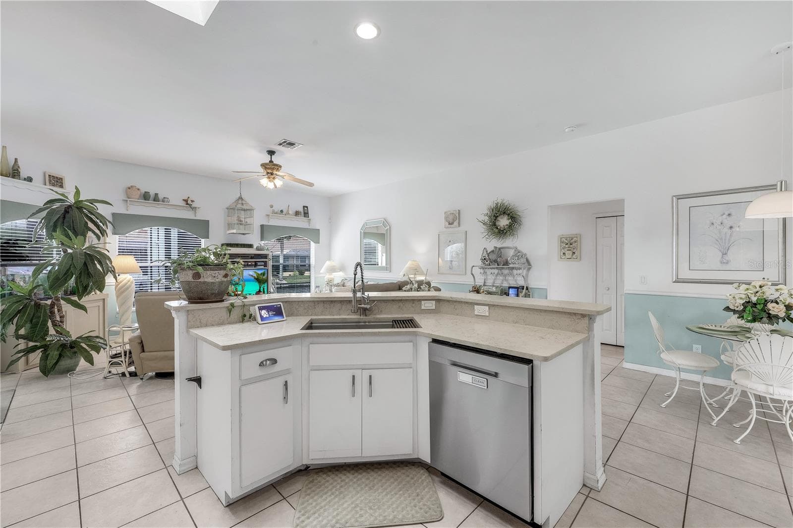 Kitchen view toward dining area and family room. - 305 SE 31ST ST, CAPE CORAL
