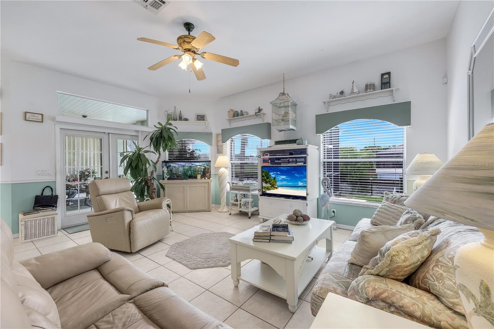 Spacious family room with access to the lanai and pool area. - 305 SE 31ST ST, CAPE CORAL