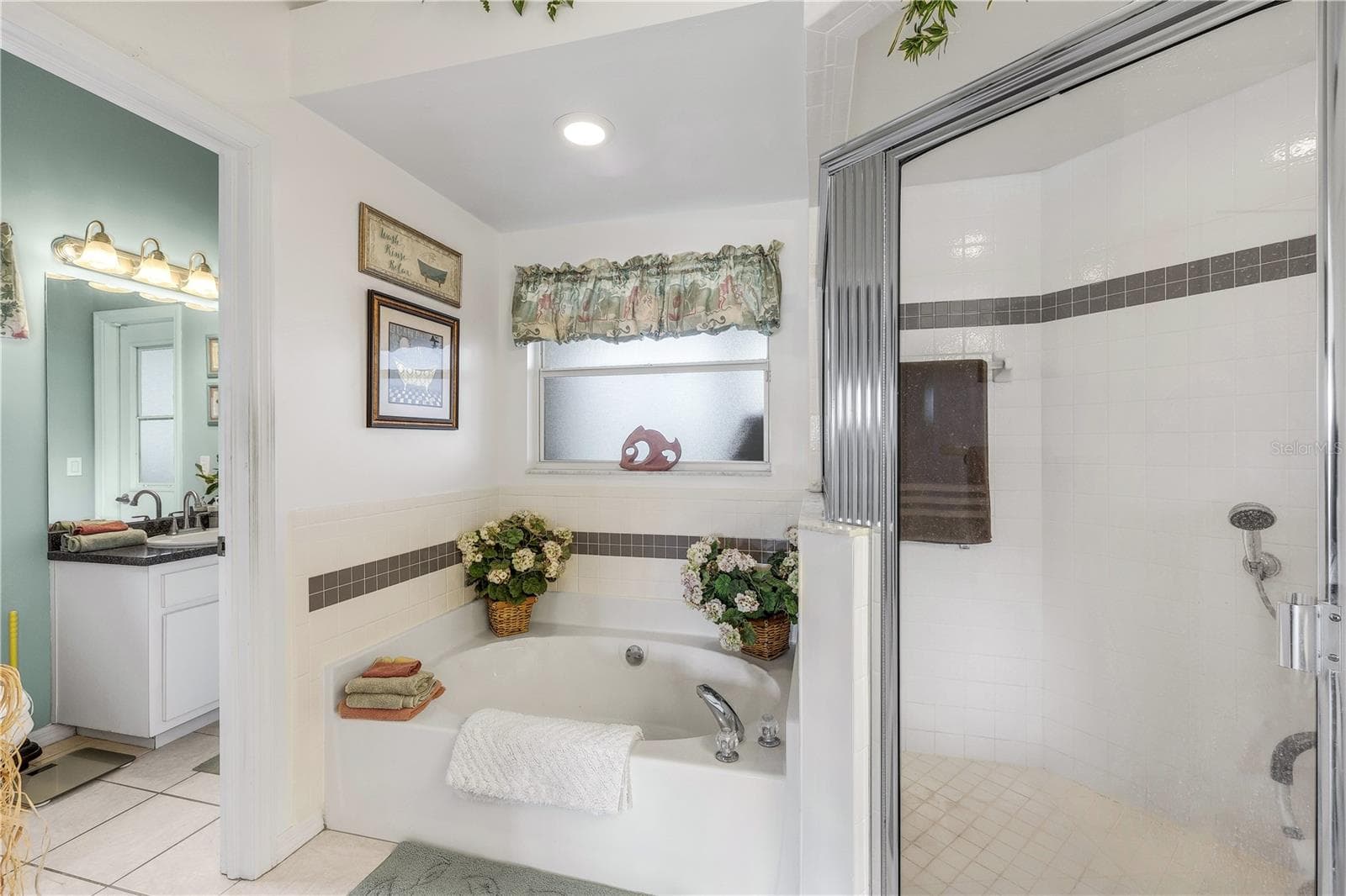 Primary bathroom toward pool bath. - 305 SE 31ST ST, CAPE CORAL