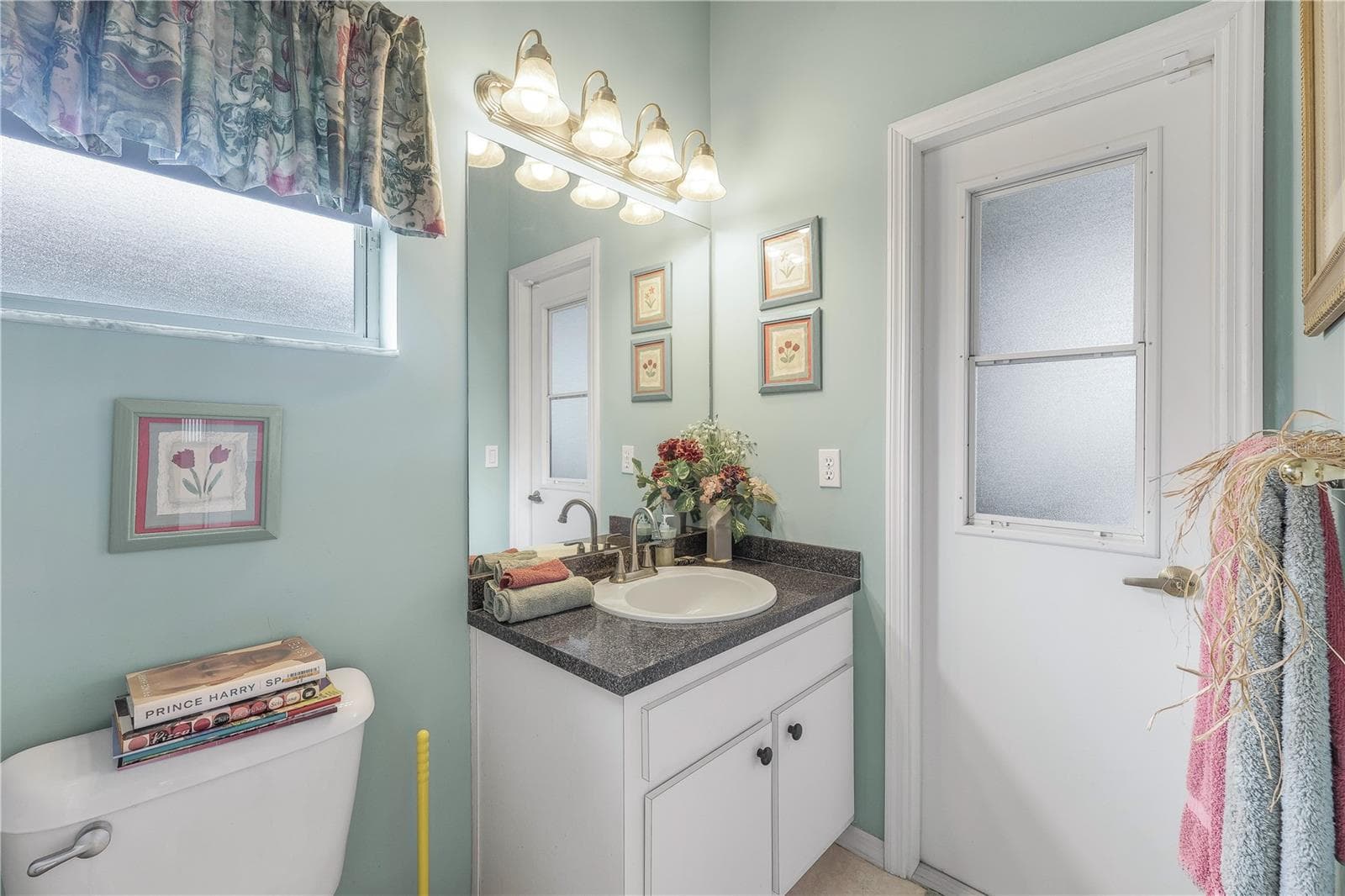 Primary bathroom doubles as private pool bath with a 3rd sink. - 305 SE 31ST ST, CAPE CORAL