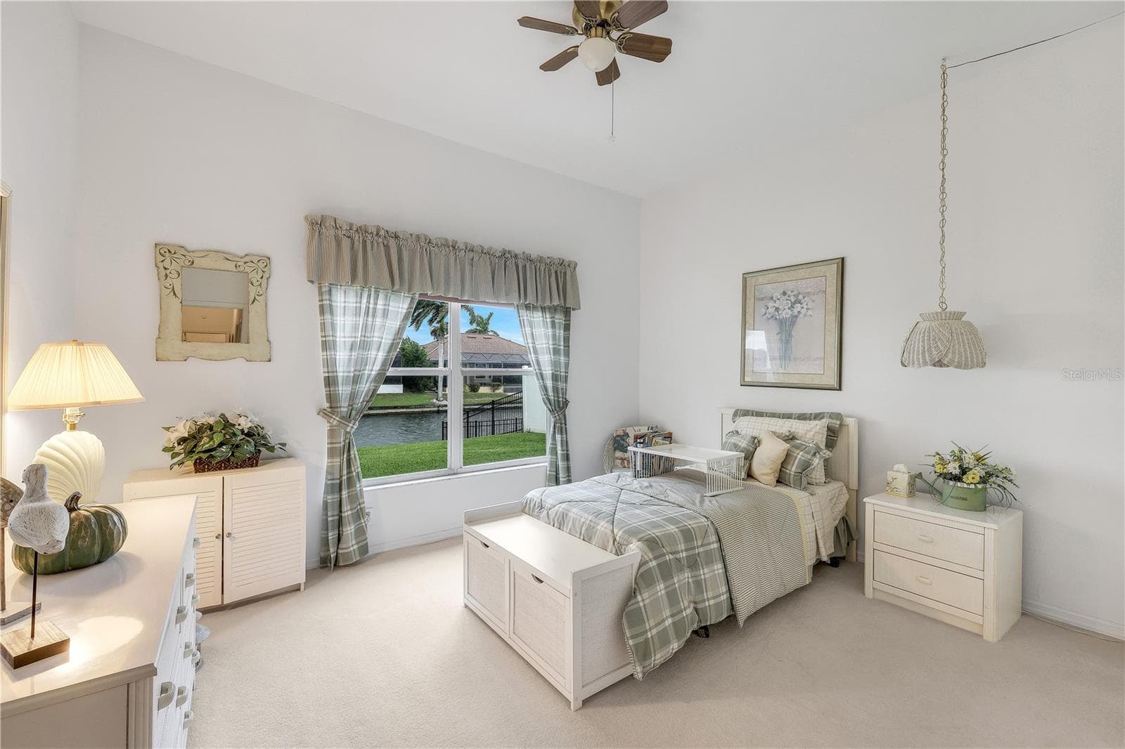 Guest bedroom #2 with a view of the water. - 305 SE 31ST ST, CAPE CORAL