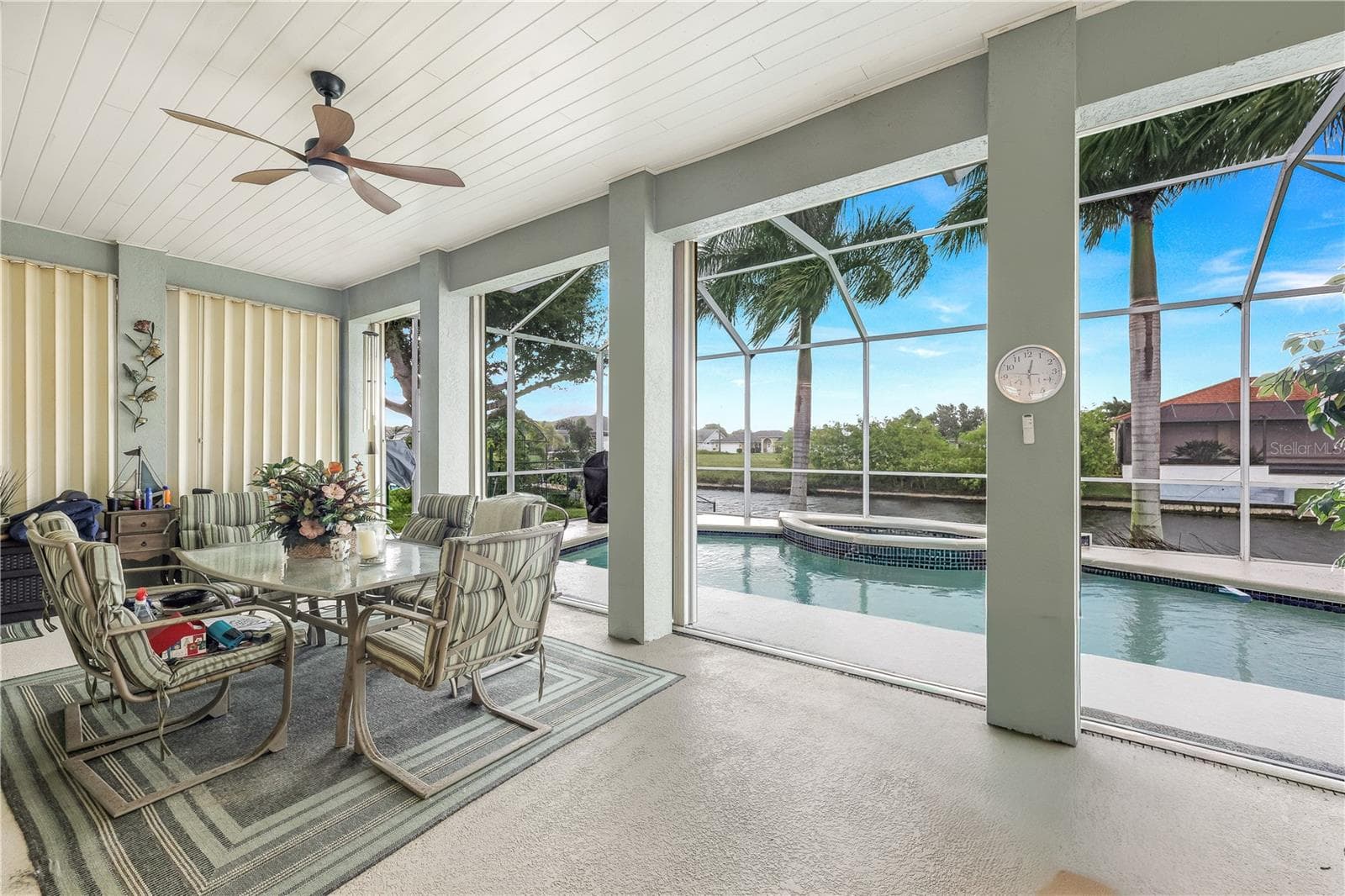 Huge lanai with accordion storm shutters and sparkling pool w/spa. - 305 SE 31ST ST, CAPE CORAL