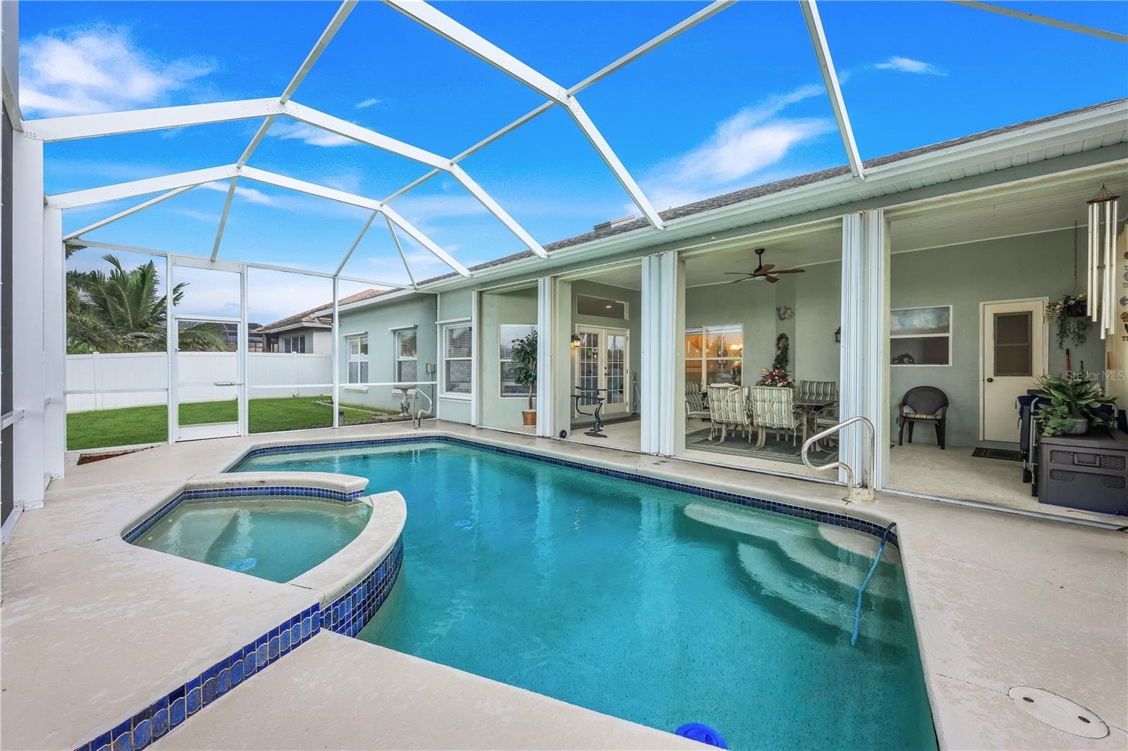 Pool and spa view toward the huge, screened lanai. - 305 SE 31ST ST, CAPE CORAL