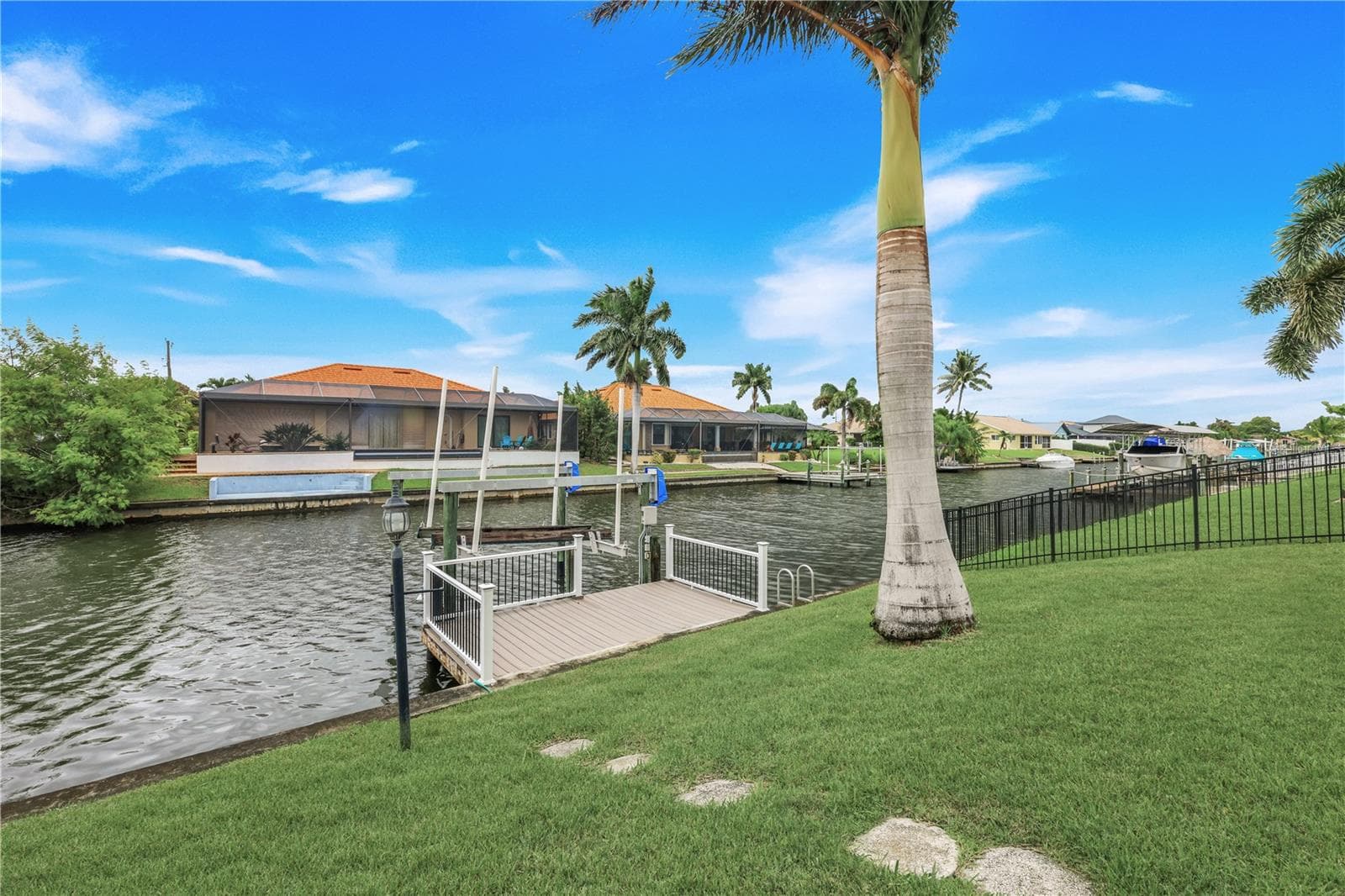 Dock and boatlift in the back of the home. - 305 SE 31ST ST, CAPE CORAL
