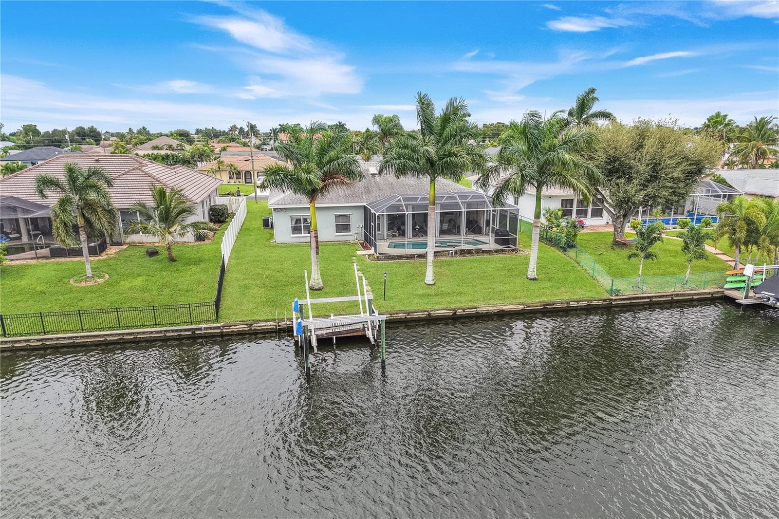 Canal view of property. - 305 SE 31ST ST, CAPE CORAL