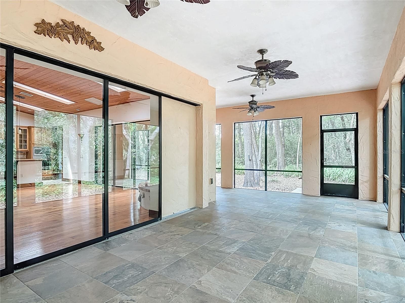 Porch sliders disappear into wall for additional living and entertaining. - 250 GARDEN ST, LAKE HELEN