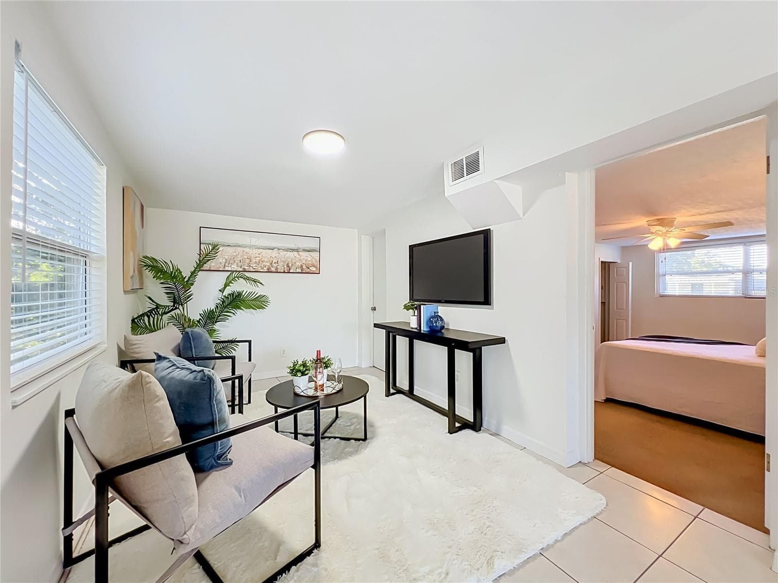Family Room with door to Primary Bedroom - 5939 DOGWOOD DR, ORLANDO