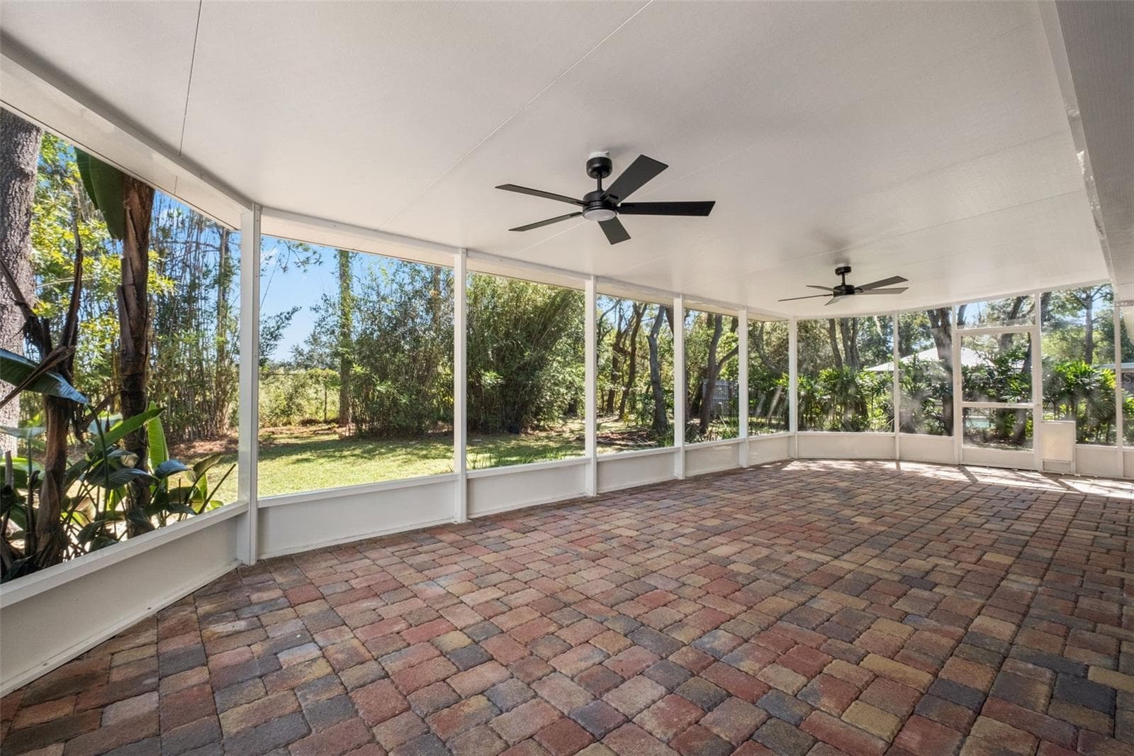Expansive Screened Rear Porch with Pavers - 2138 FAIRVIEW RD, SPRING HILL