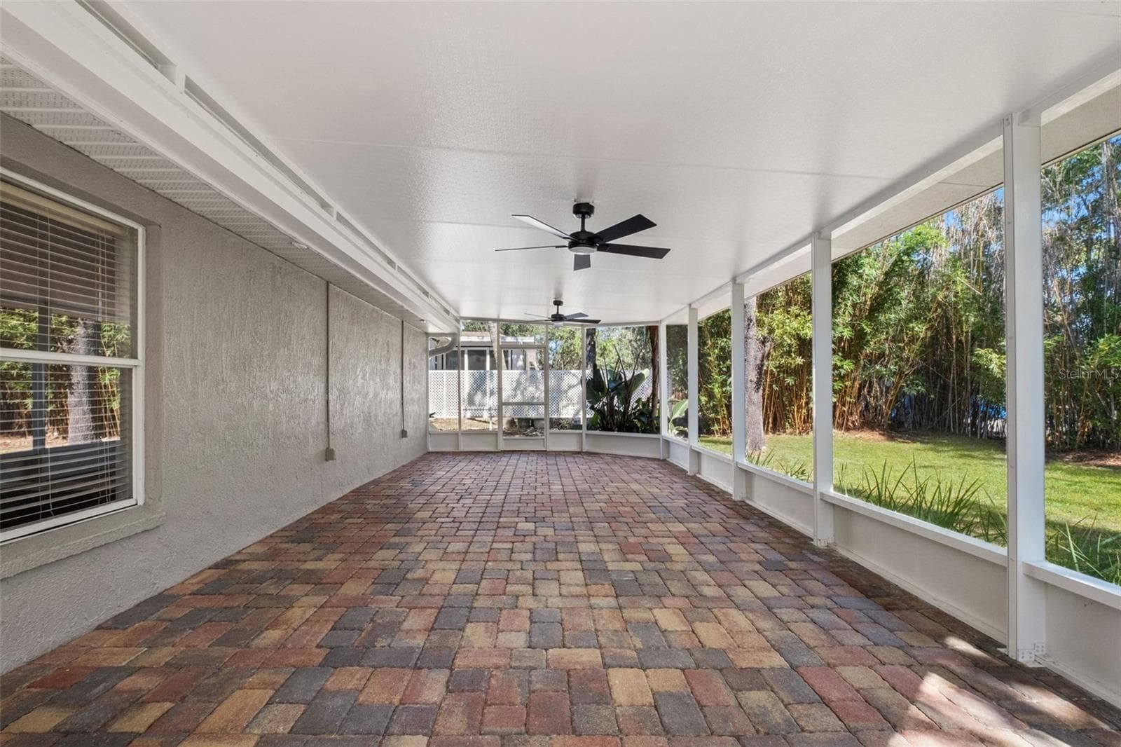 Expansive Screened Rear Porch with Pavers - 2138 FAIRVIEW RD, SPRING HILL